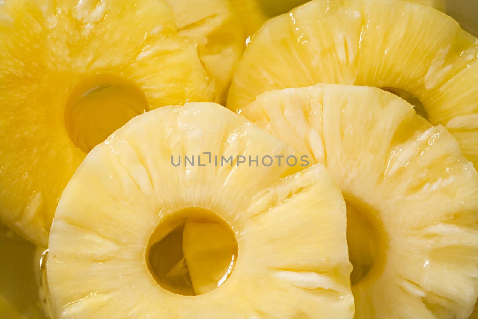 Pineapple compote with circles of pineapple close up
