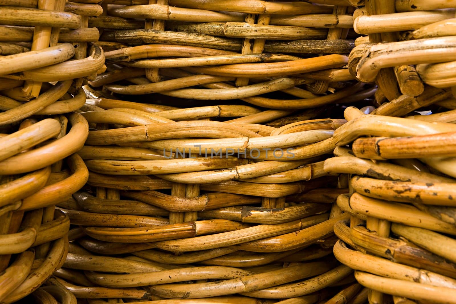 The baskets roughly weaved from willow rods close up
