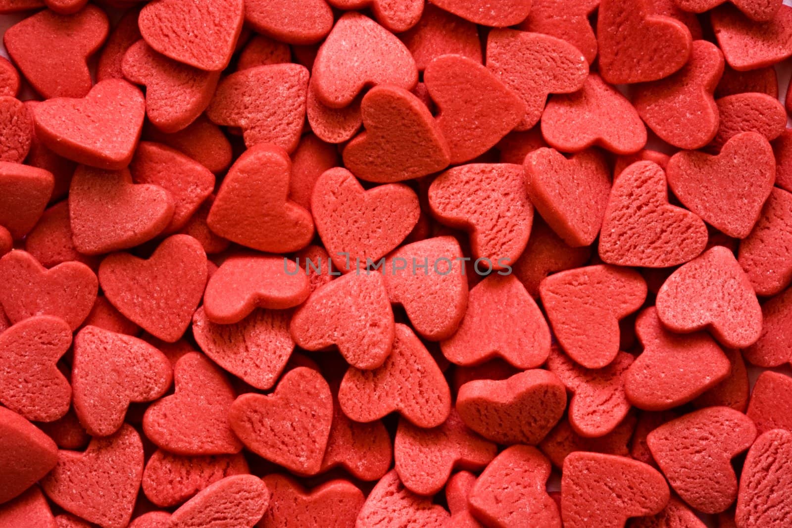 Confectionery ornaments in the form of red hearts close up

