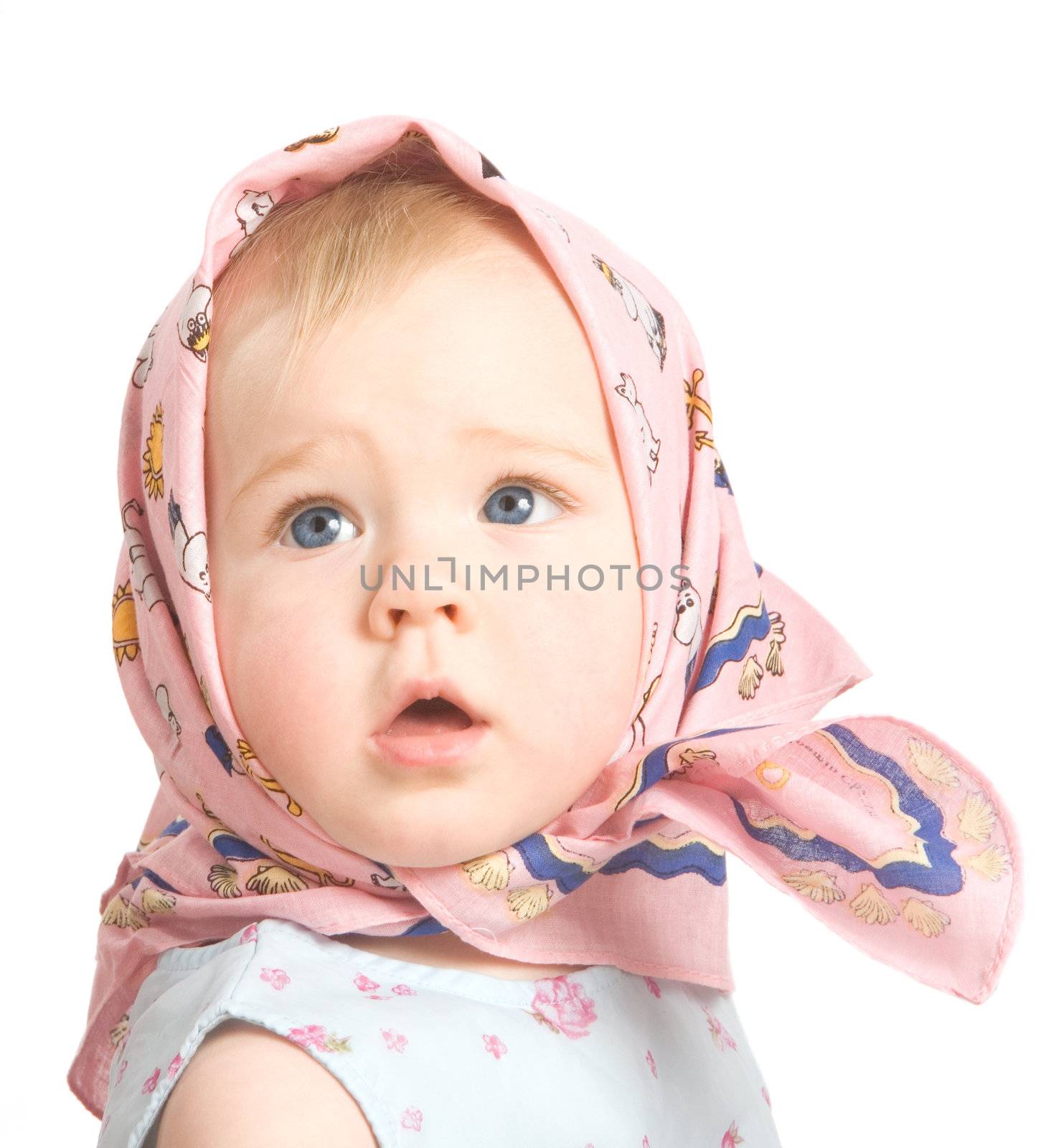 The one-year-old baby in a pink scarf on a white background
