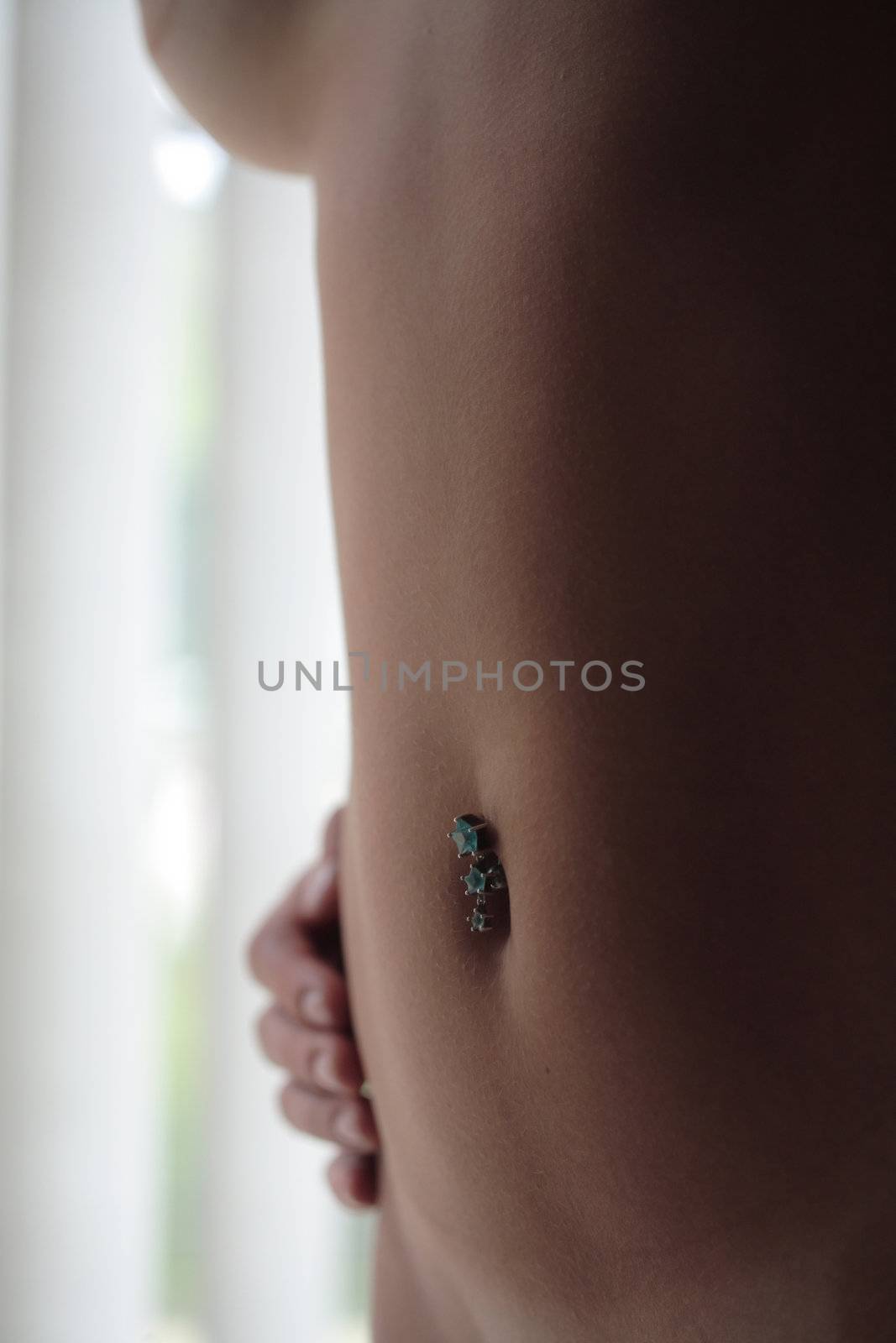 The bare body or part of a 18 year old Brazilian blond. (This image is part of a series).