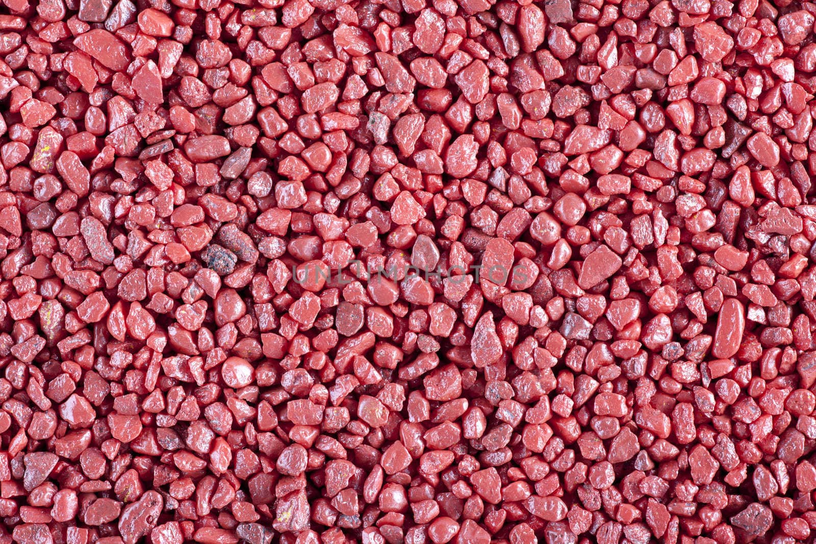 Red aquarium stones background or texture