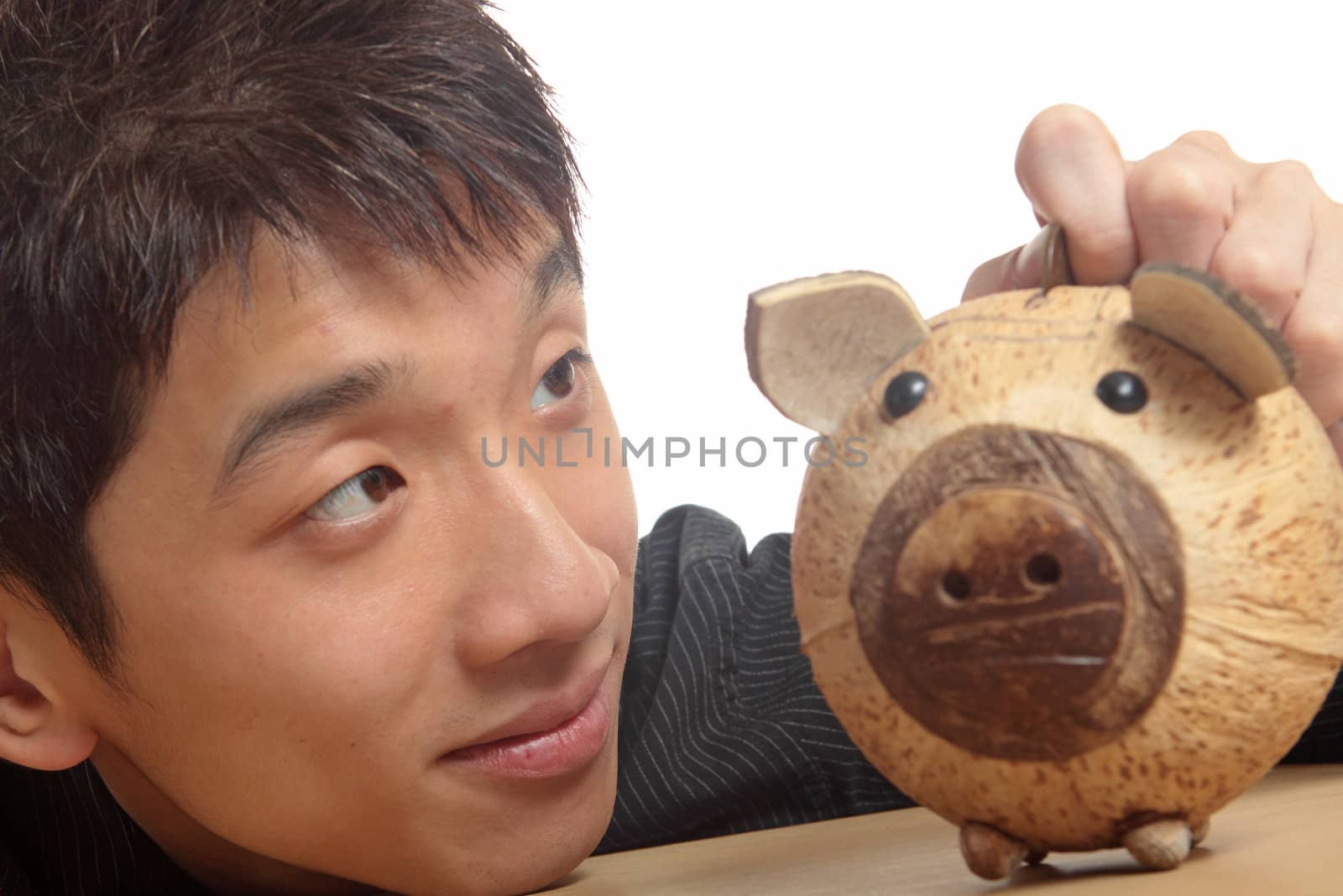 asia man with piggy bank 