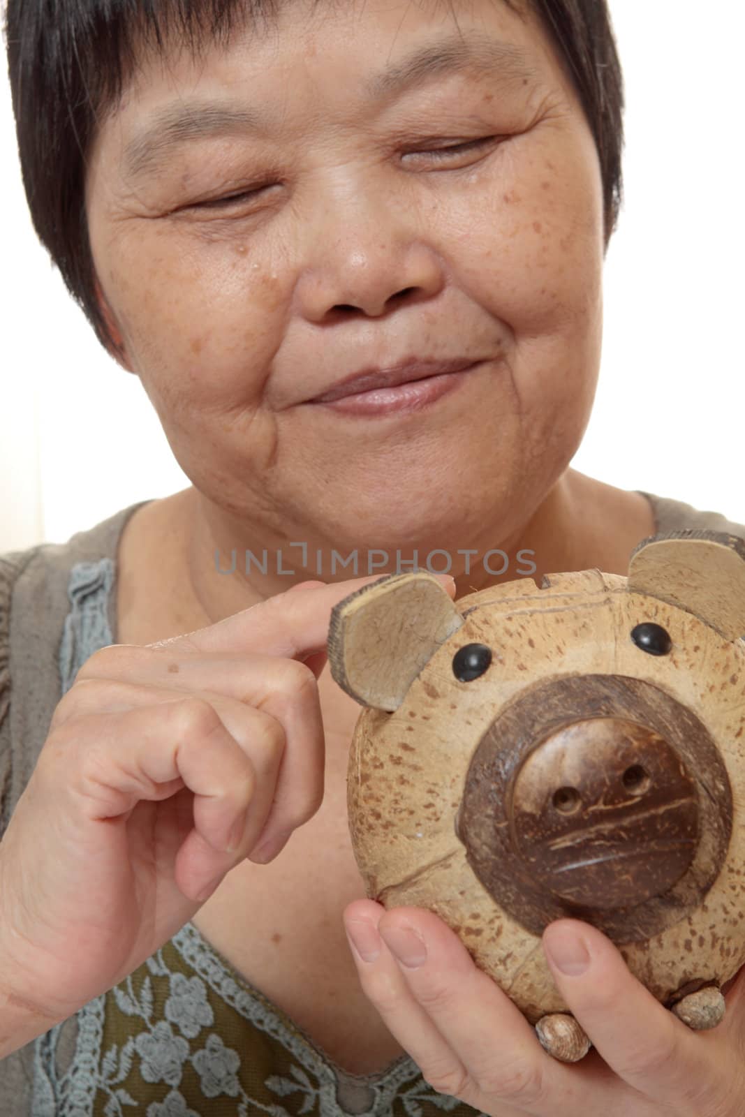 woman putting coins in small piggy bank. Selective focus, Copy space 