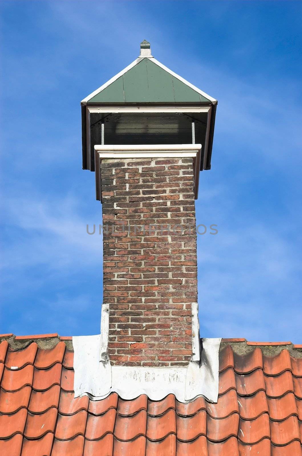 Chimney over a red tiled roof