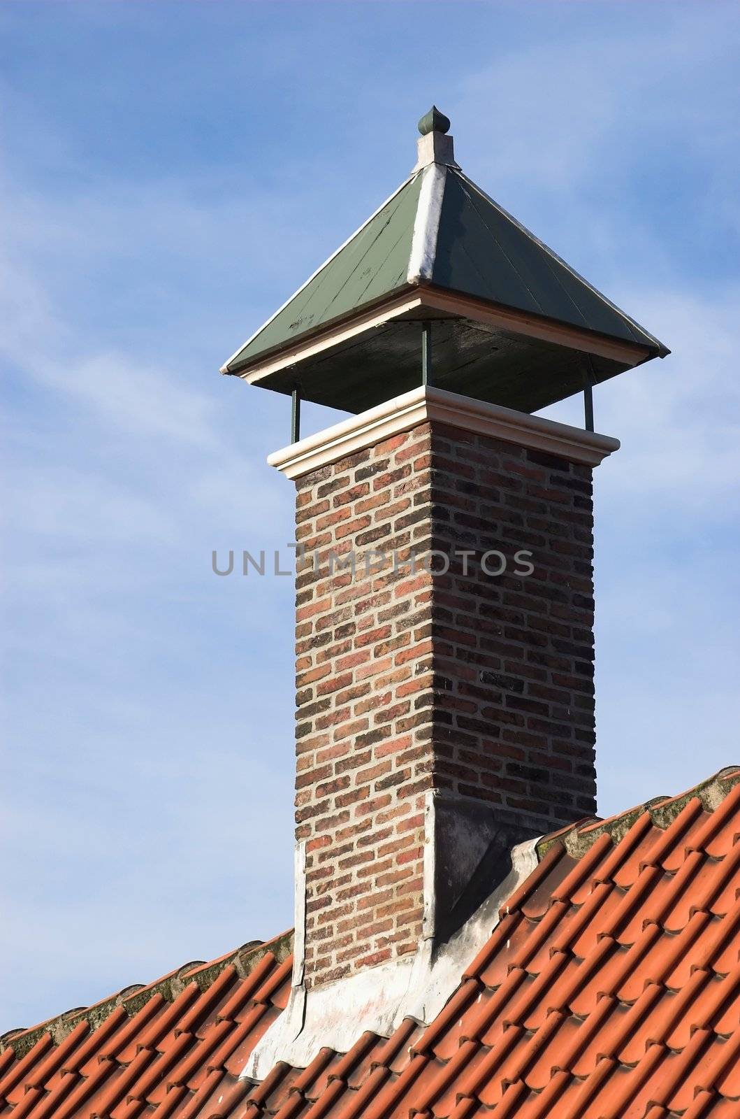 Chimney over a red tiled roof