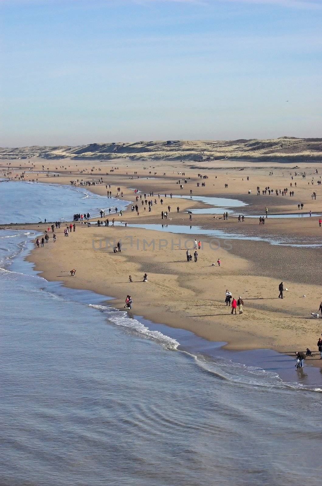 People gathering at the beach in Scheveningen in early spring