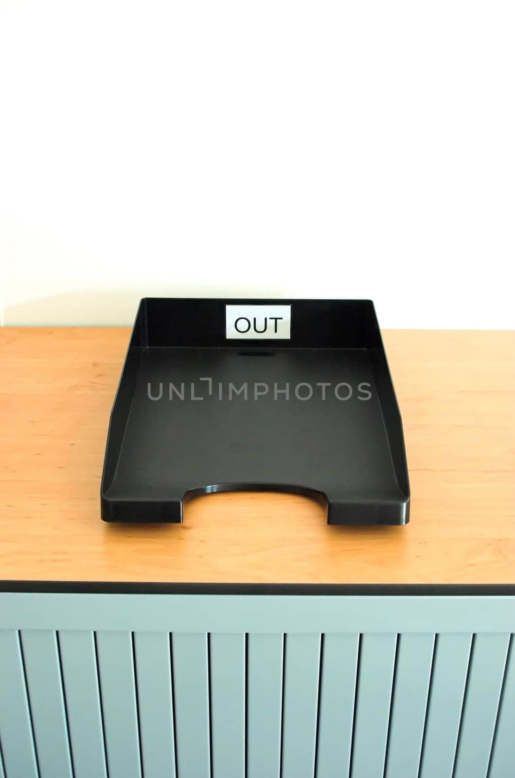 Internal mail trays on a cupboard in an office