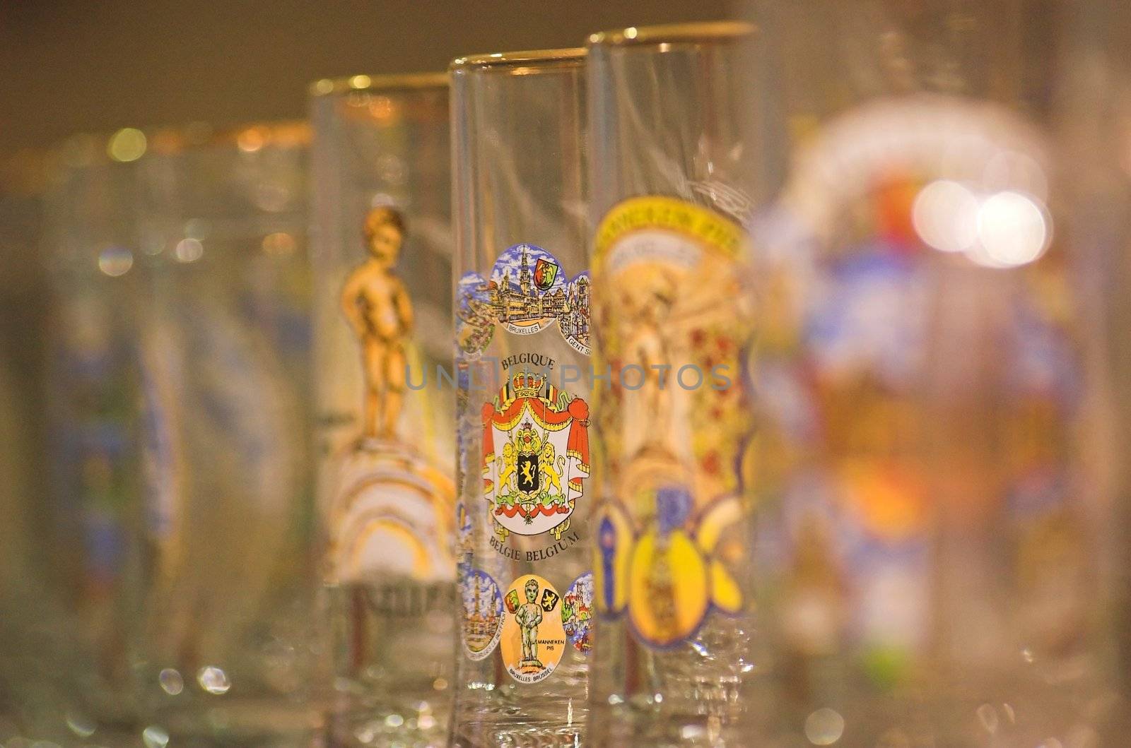 Belgian beer glasses on a shelf in a souvenir shop in Brussels