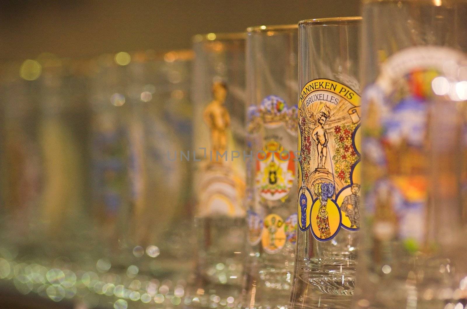 Belgian beer glasses on a shelf in a souvenir shop in Brussels