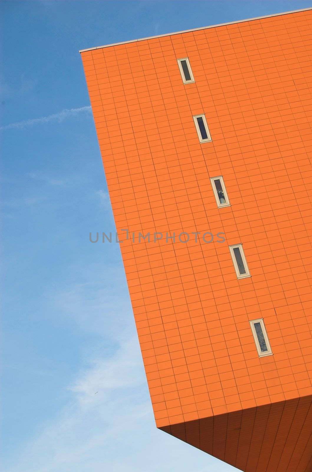 Modern office building made of red brick and glass in Hoogvliet, Holland