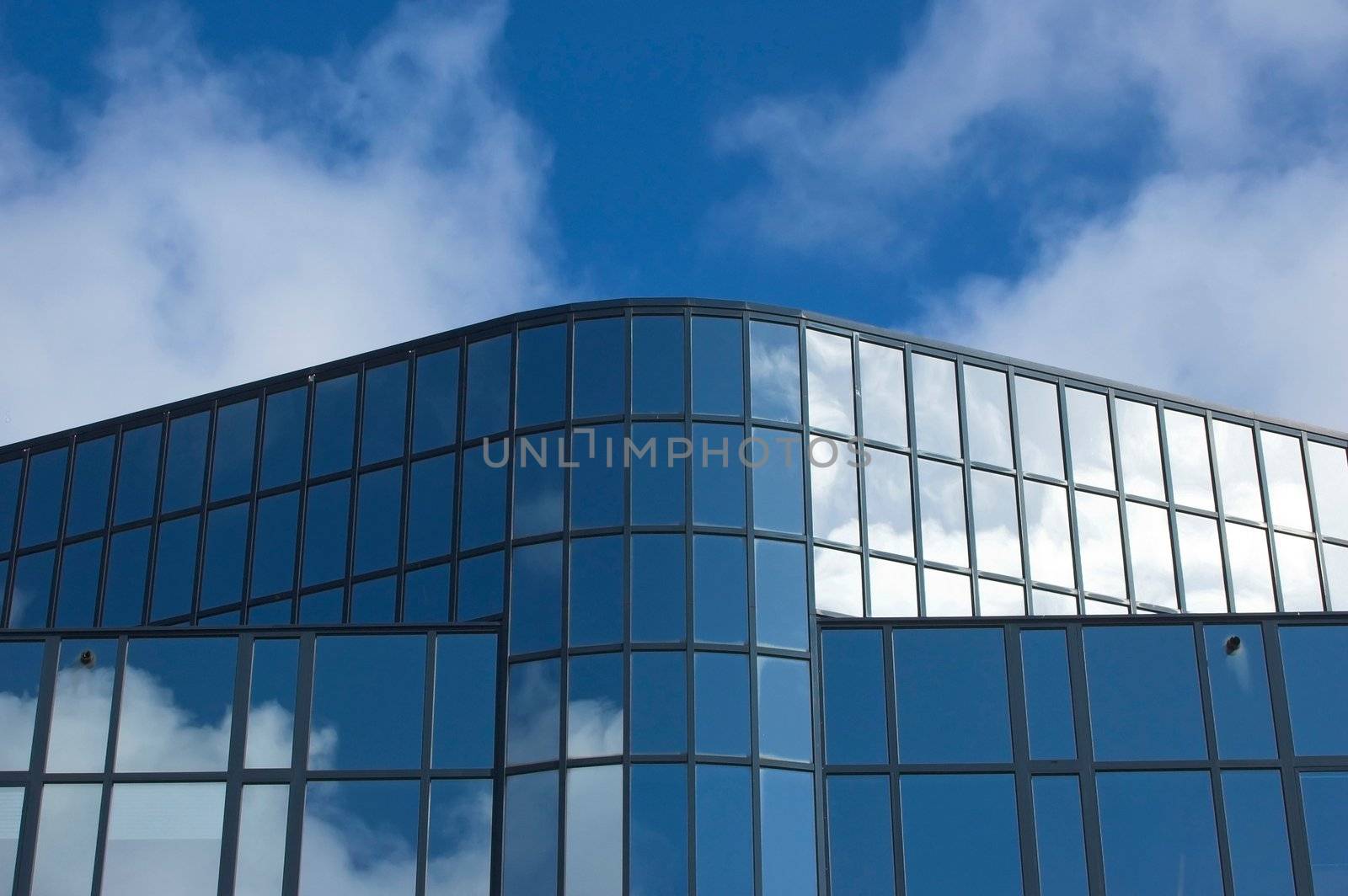 Detail of an office building facade with blue windows