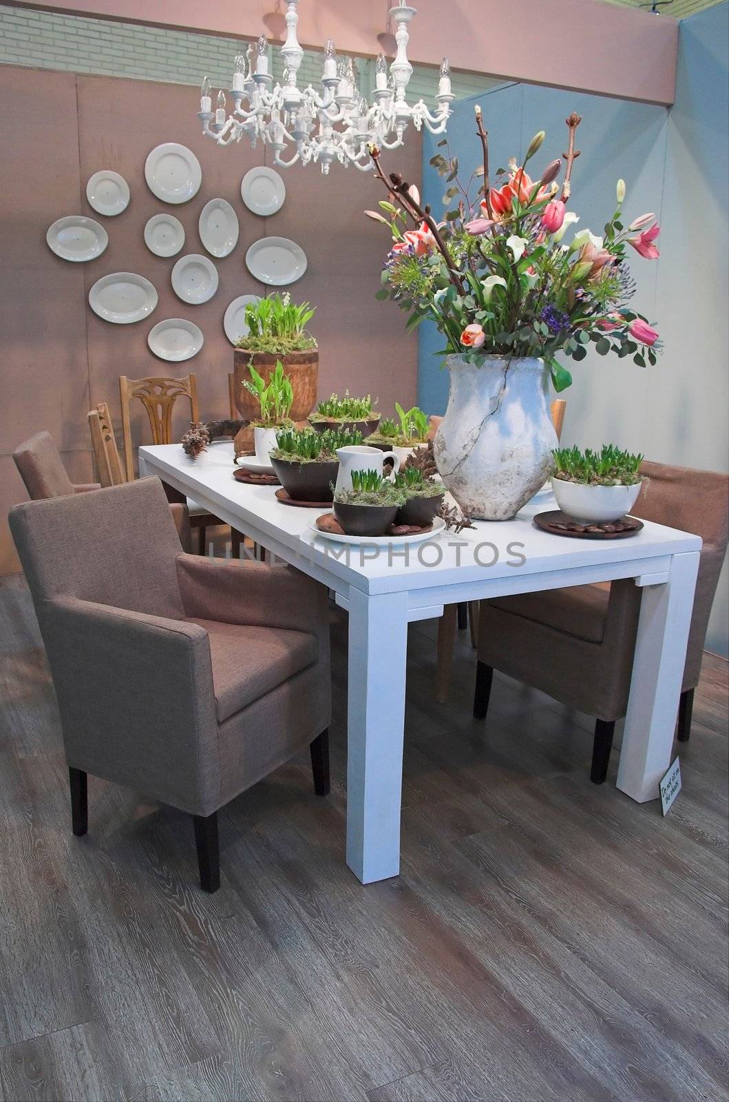 Modern dining room arranged with flowers in various colors