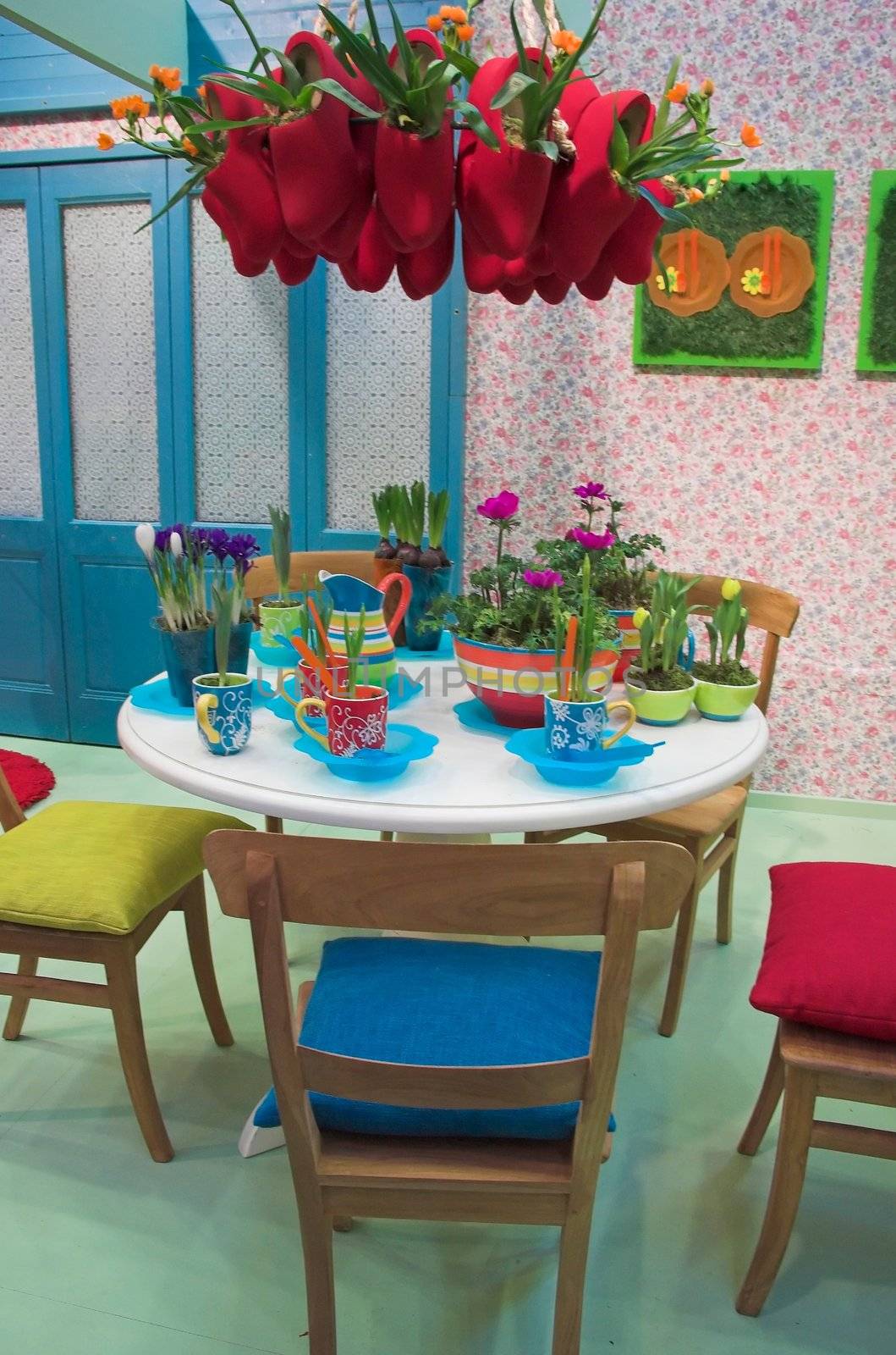 Modern dining room arranged with flowers in various colors