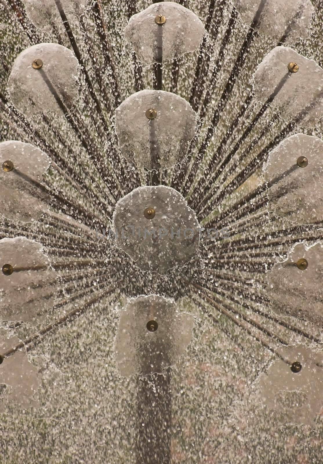 Modern water fountain in black steel splashing water