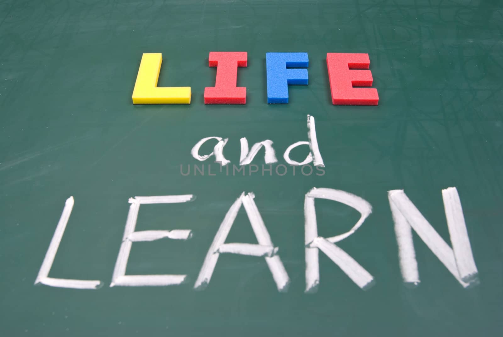 Life and learn, lifestyle words on blackboard.