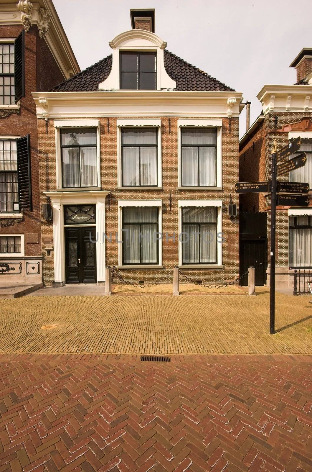 Old XIX-century residential house in Dutch style, in the city centre of Sneek, Holland