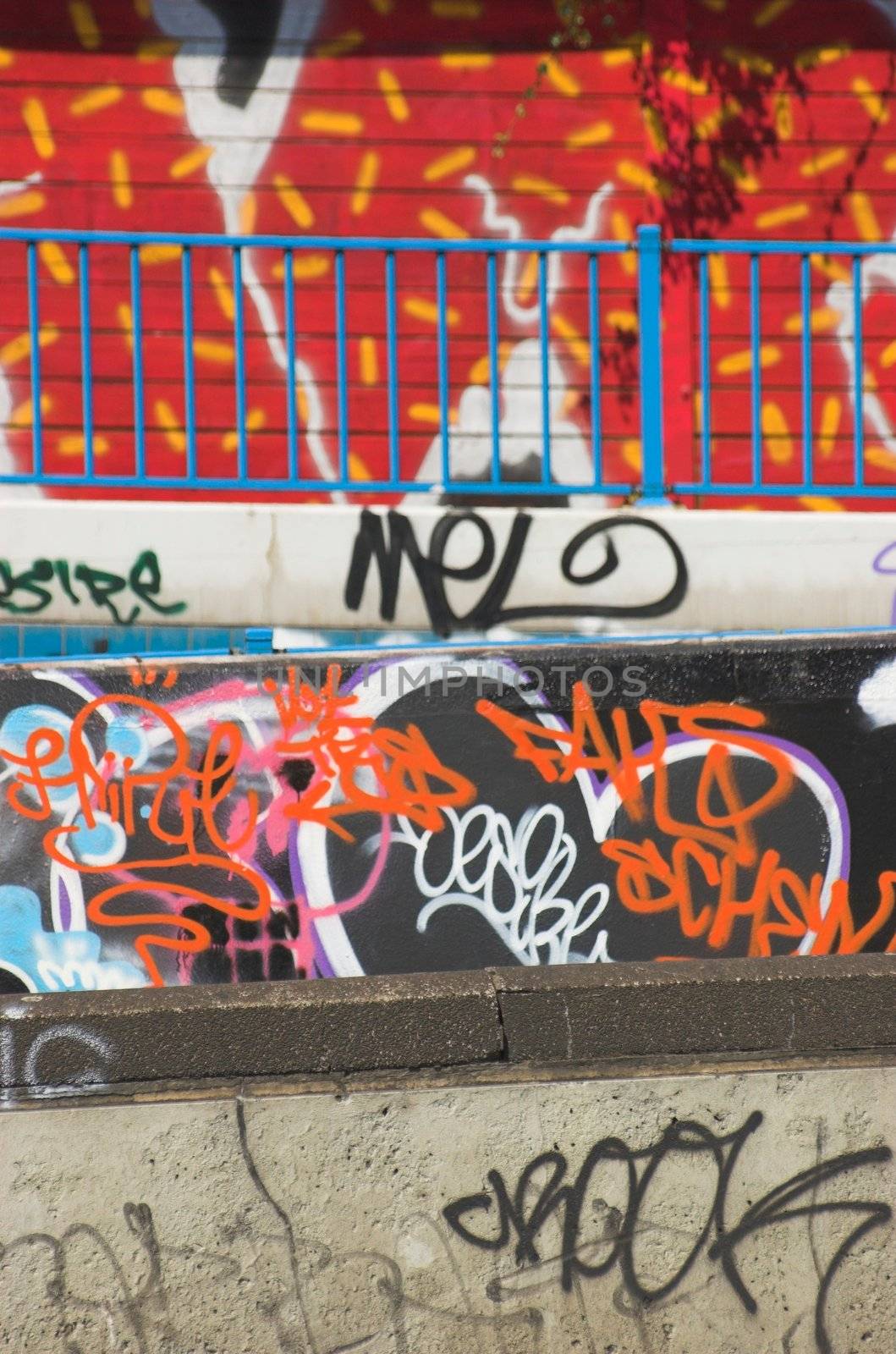 Grafitti on a wall of a pedestrian bridge crossing