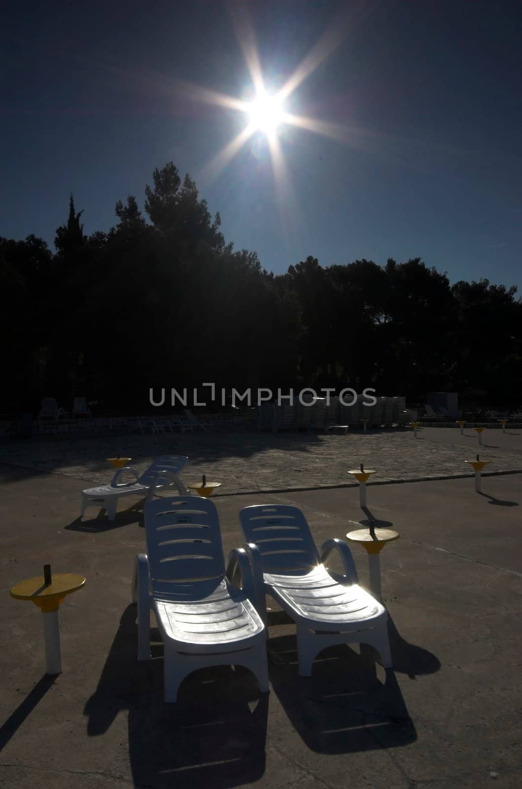 Plastic beach chair at the edge of a sea