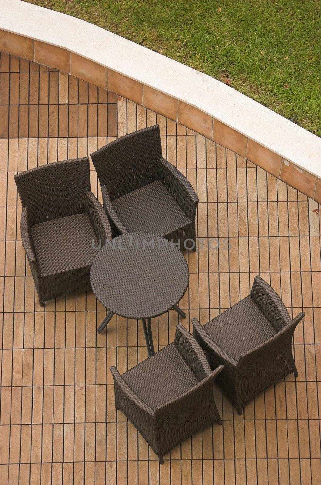 a set of chairs and a table on a terrace