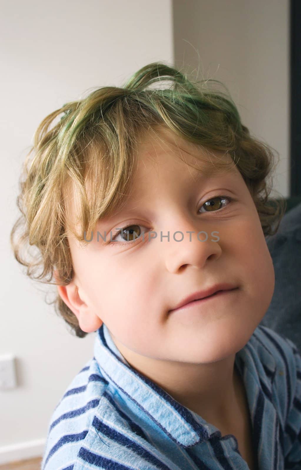 Young male boy hanging around in his pyjamas for the day.