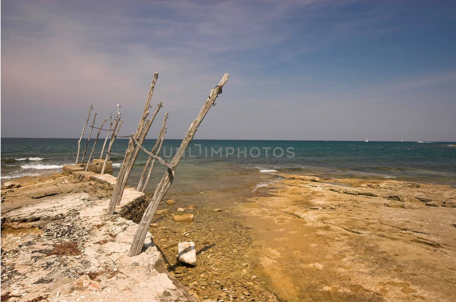 Croatian shore, wooden holders used for lifting boats