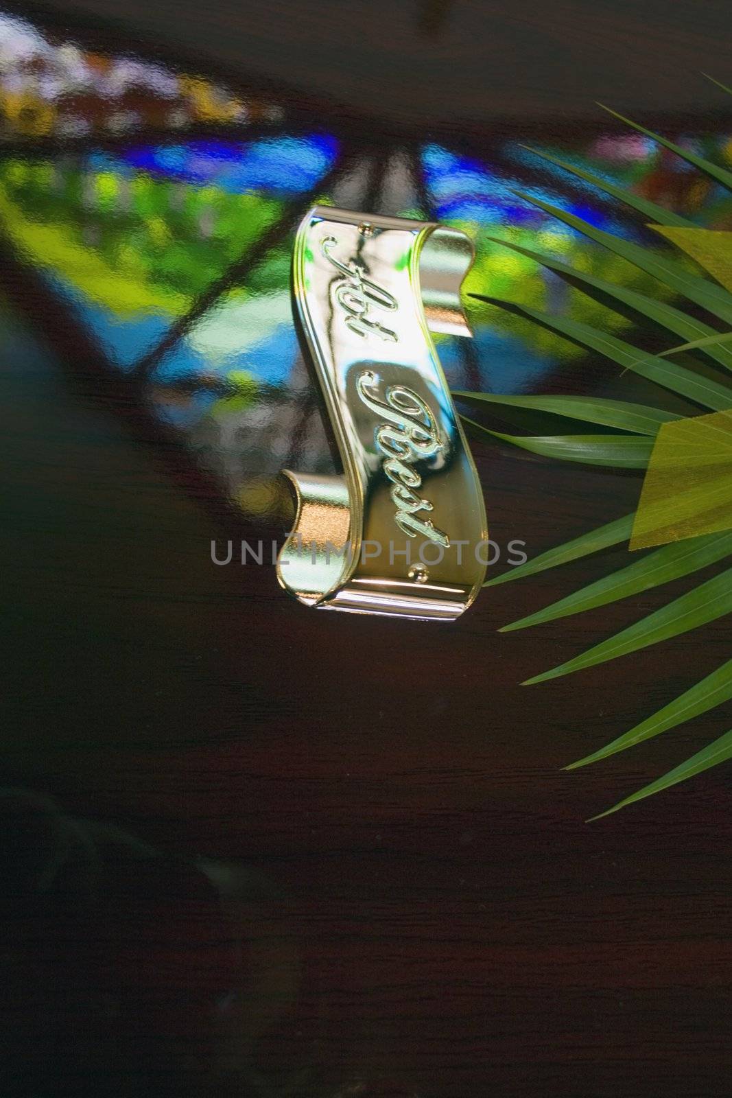 Stained Glass window reflection on a casket