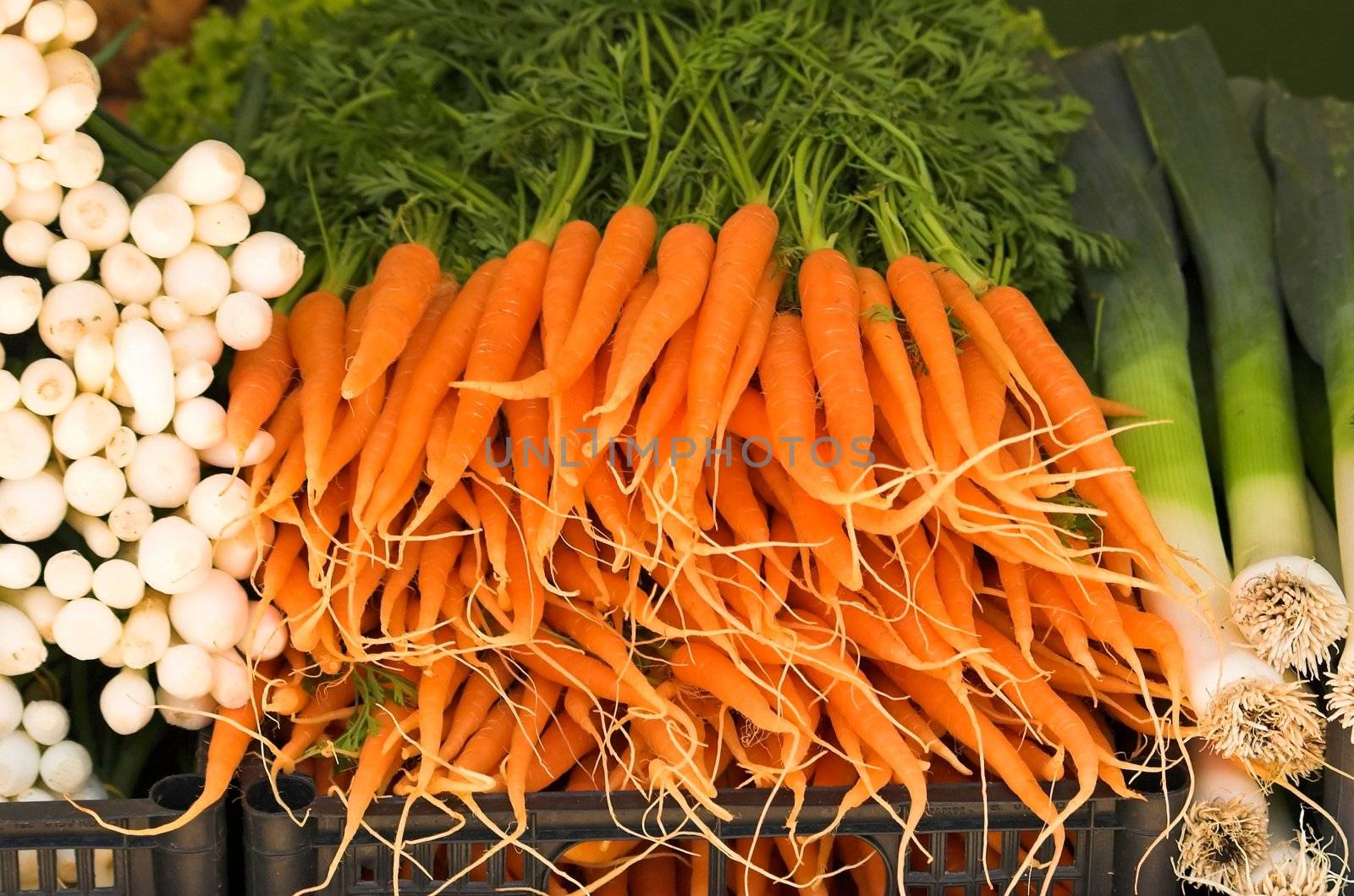 Carrots for sale on top of a traditional market stall