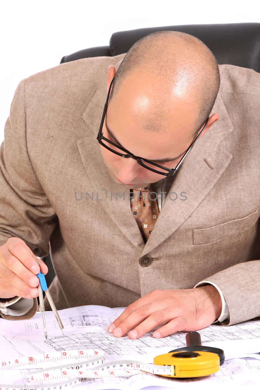 A Businessman working with architectural plans