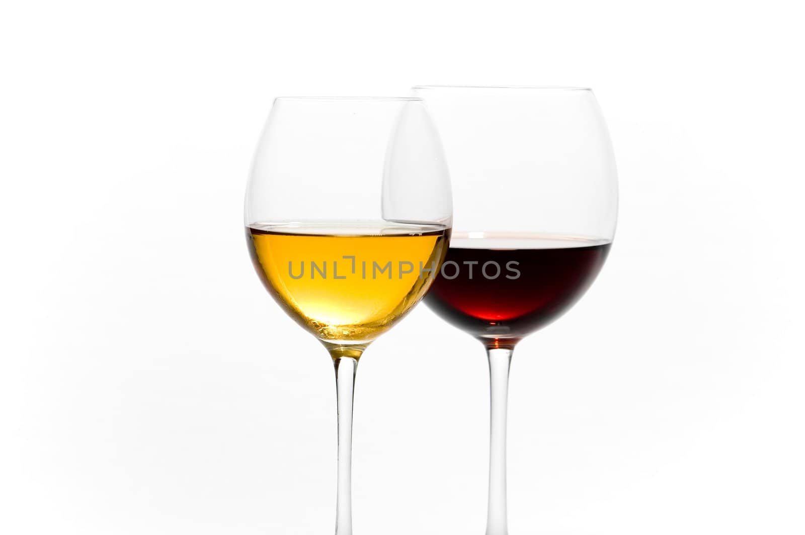 Two tall glasses isolated on white filled with red and white wine
