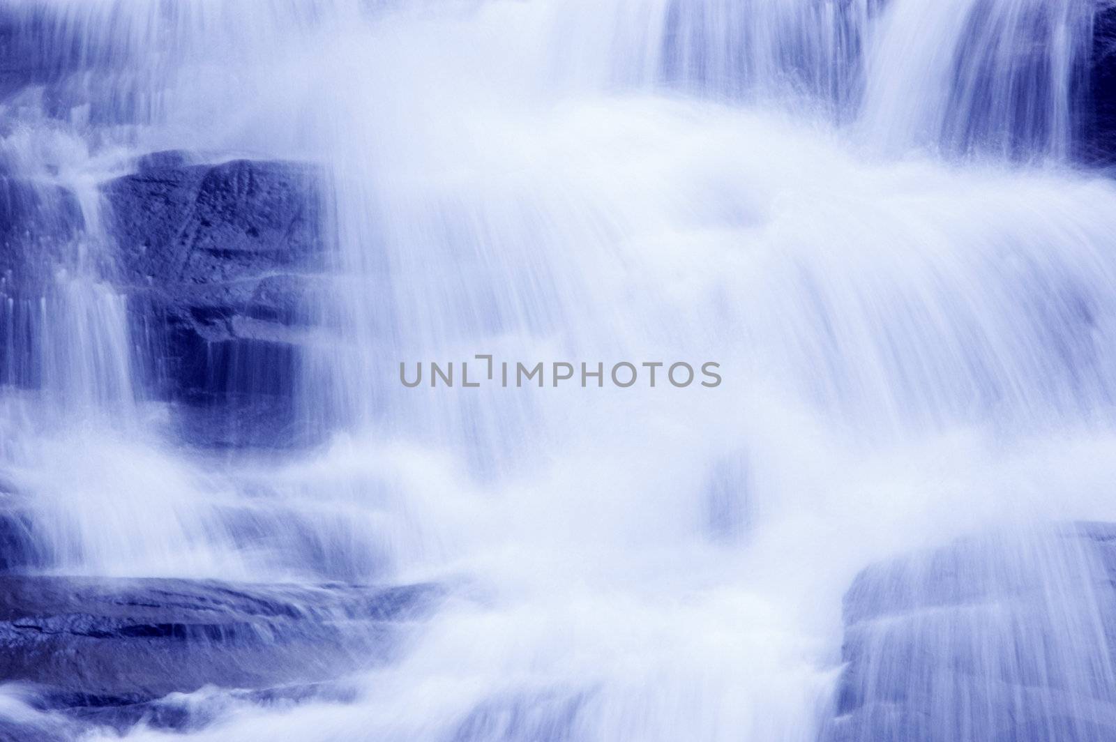 Waterfall in japanese garden, blue tone. 
