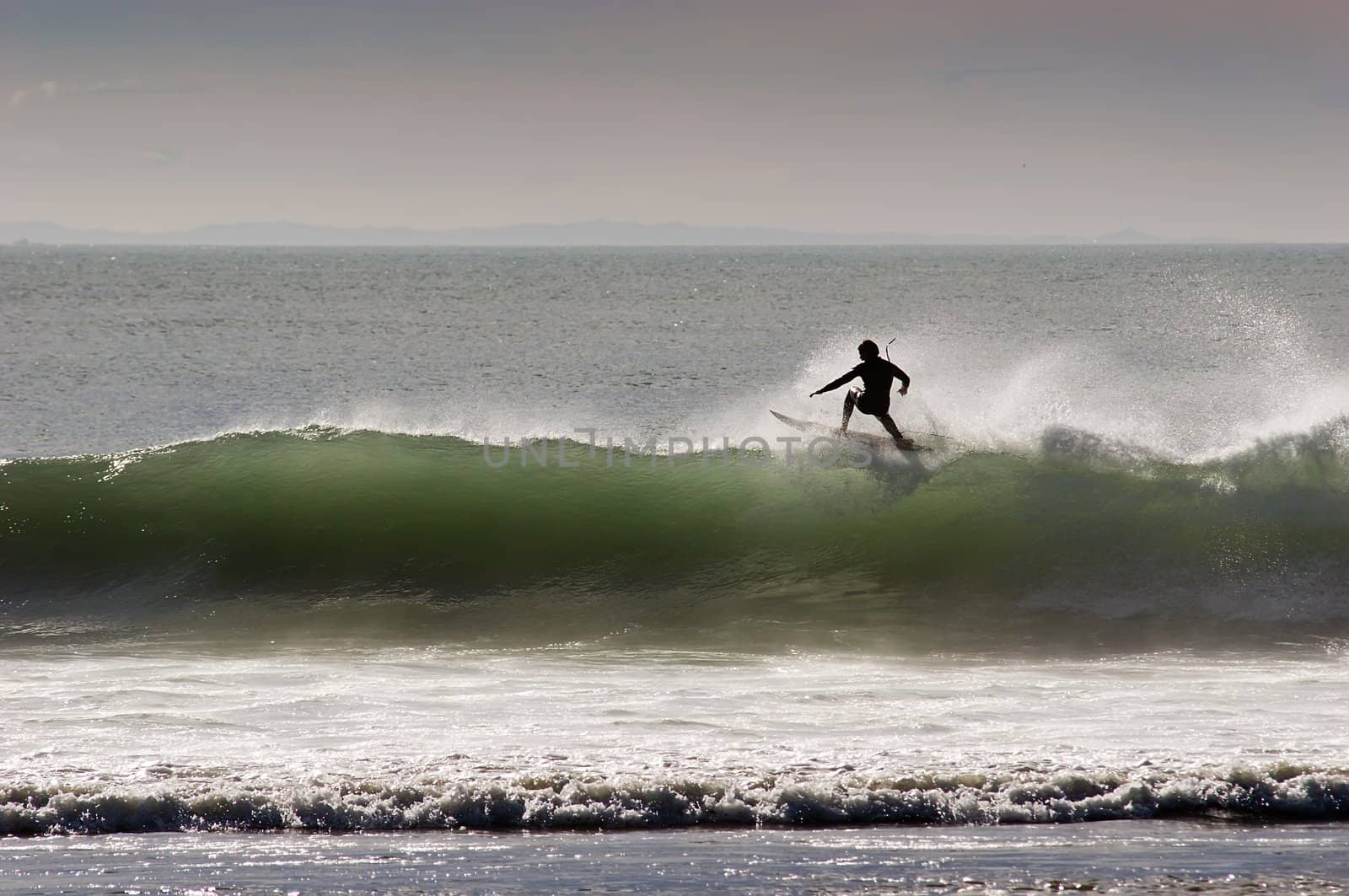 Surfing the break at Haumoana Beach, Hawke's Bay, New Zealand