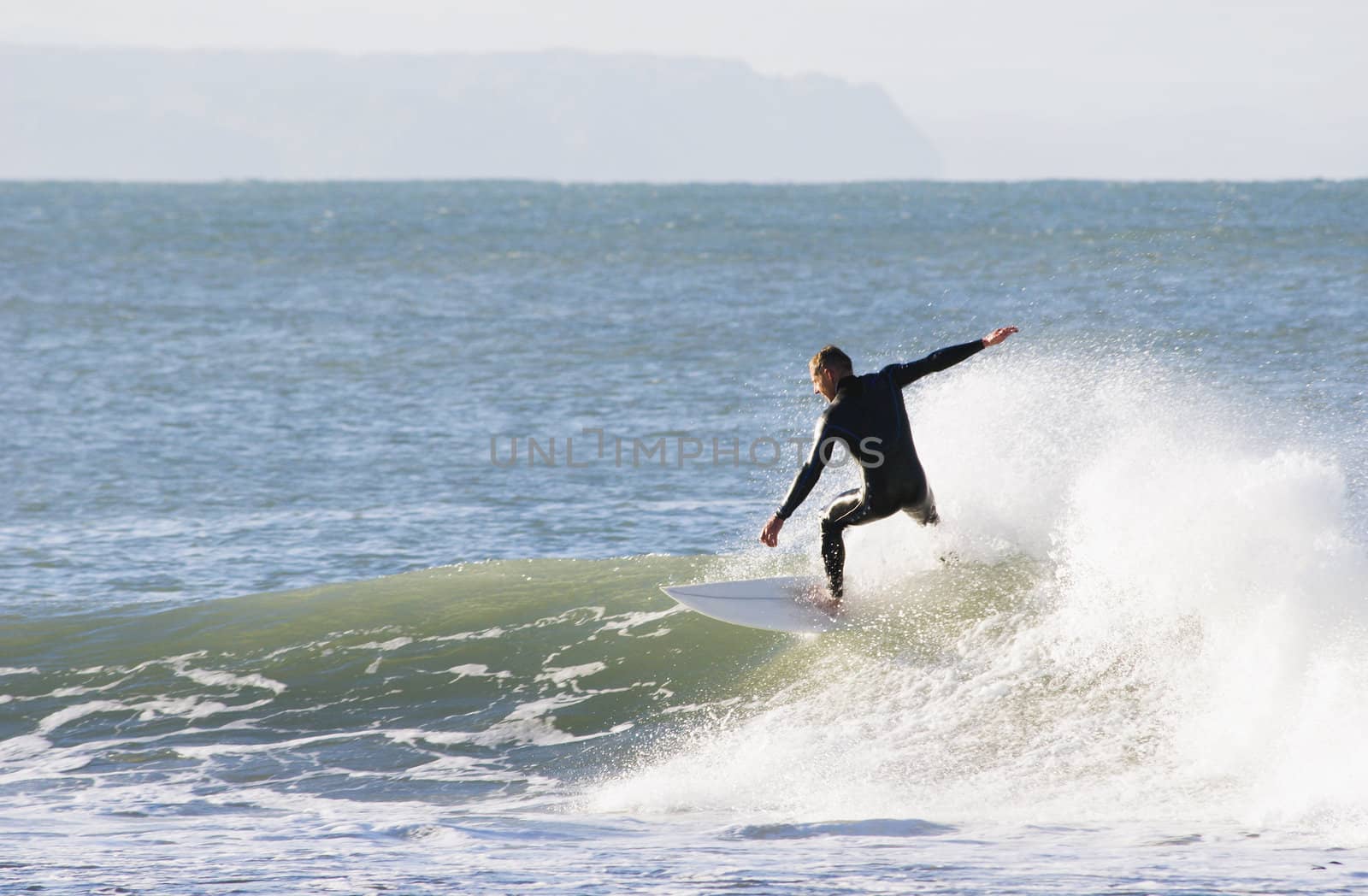 Surfing the break at Haumoana Beach, Hawke's Bay, New Zealand