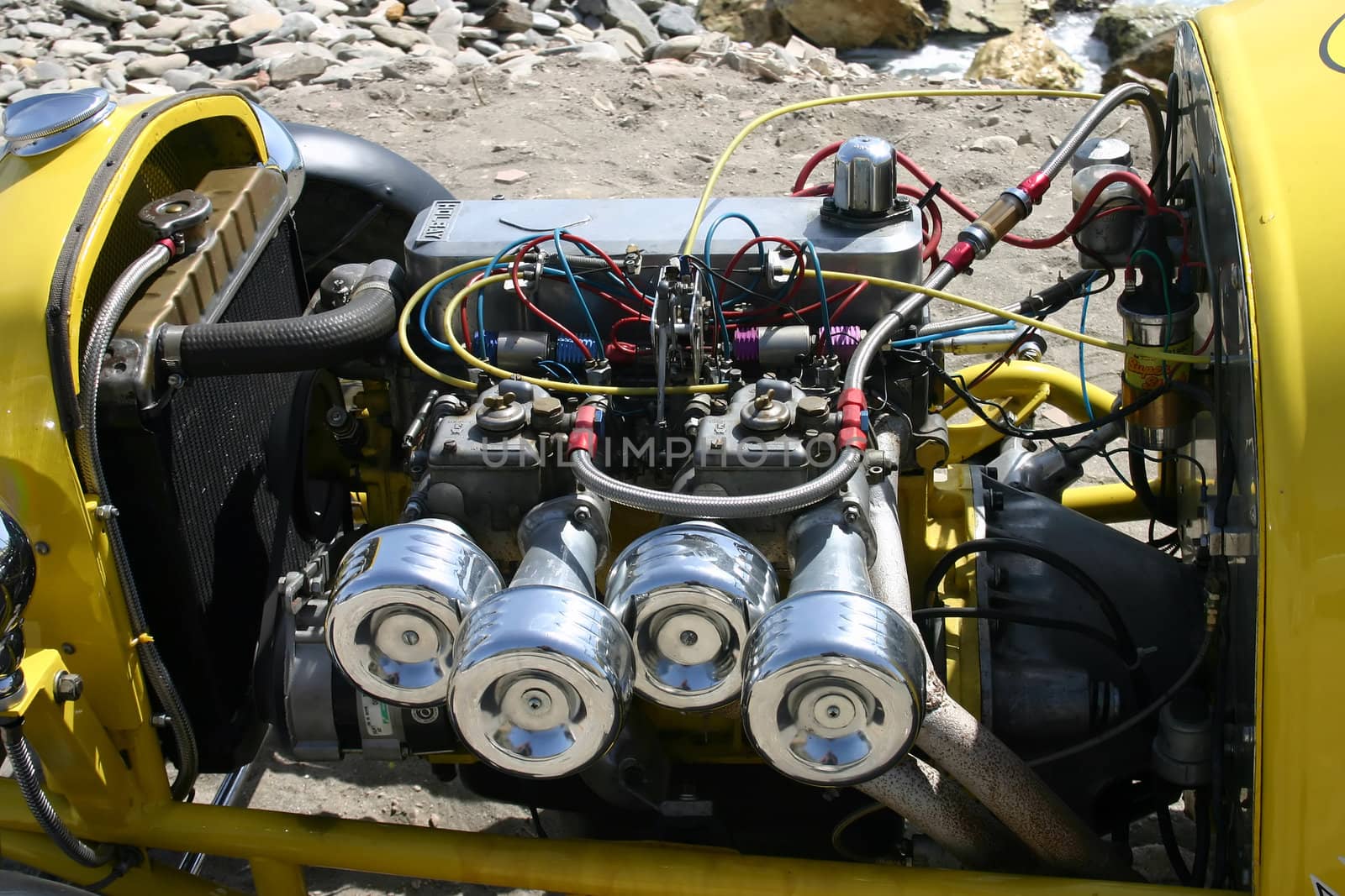 Open engine of a yellow hot rod