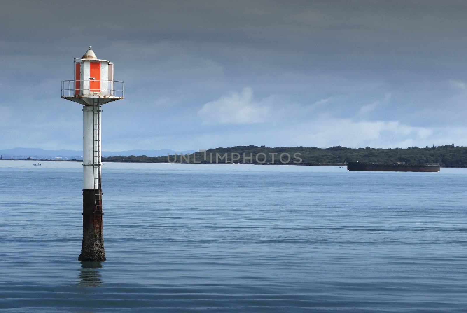 A beacon stands guard on the Rangitoto Channel in the Hauraki Gulf, New Zealand.