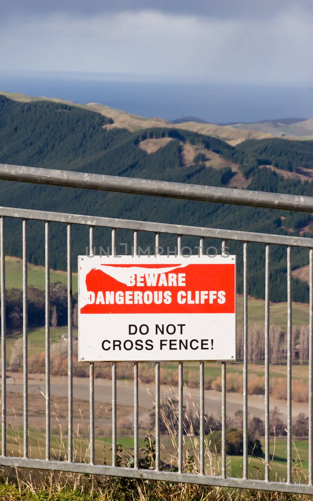 A sign on a fence on Te Mata Peak looking out toward the East Coast of Hawke's Bay, New Zealand
