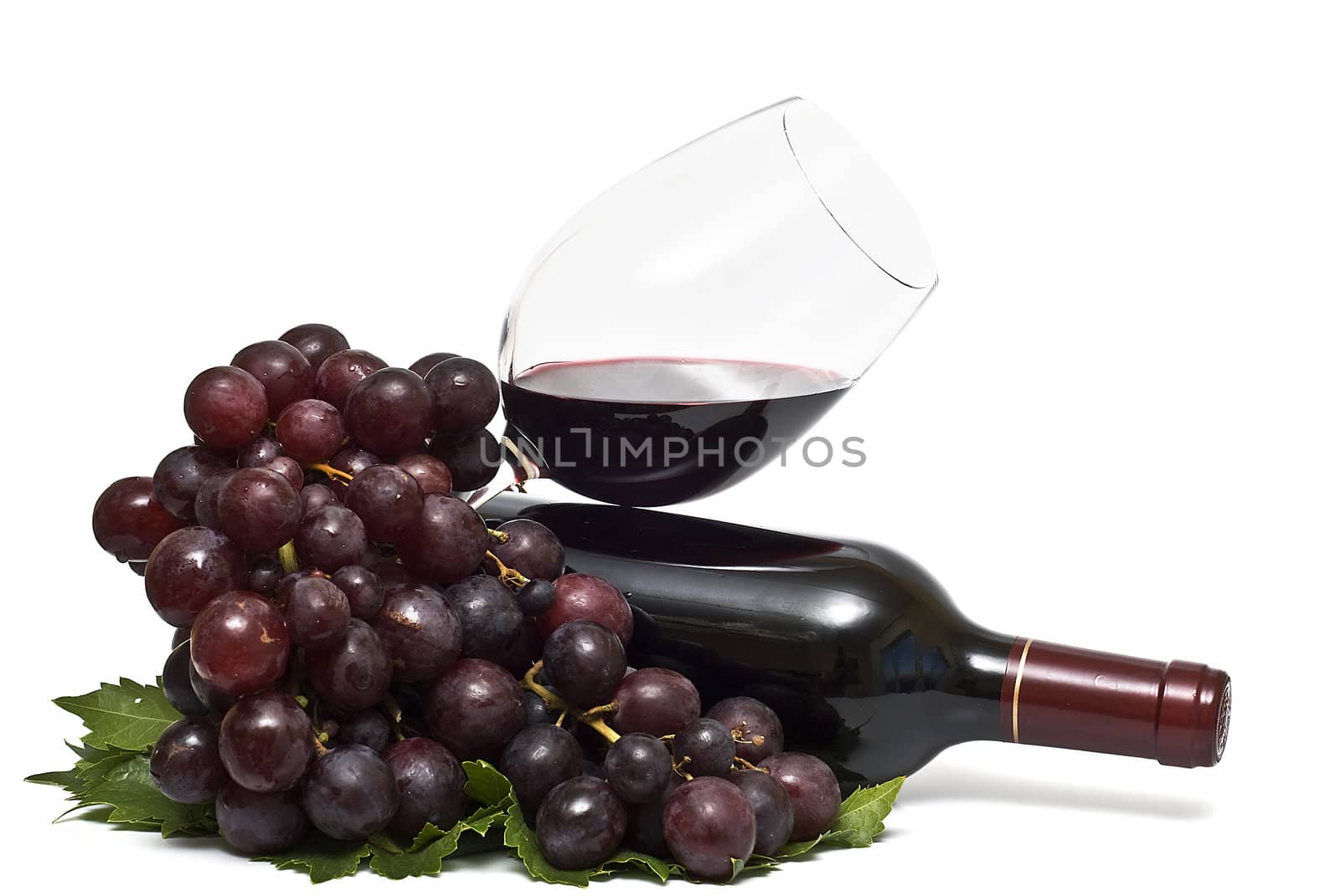 Still life abour red wine with a white background.