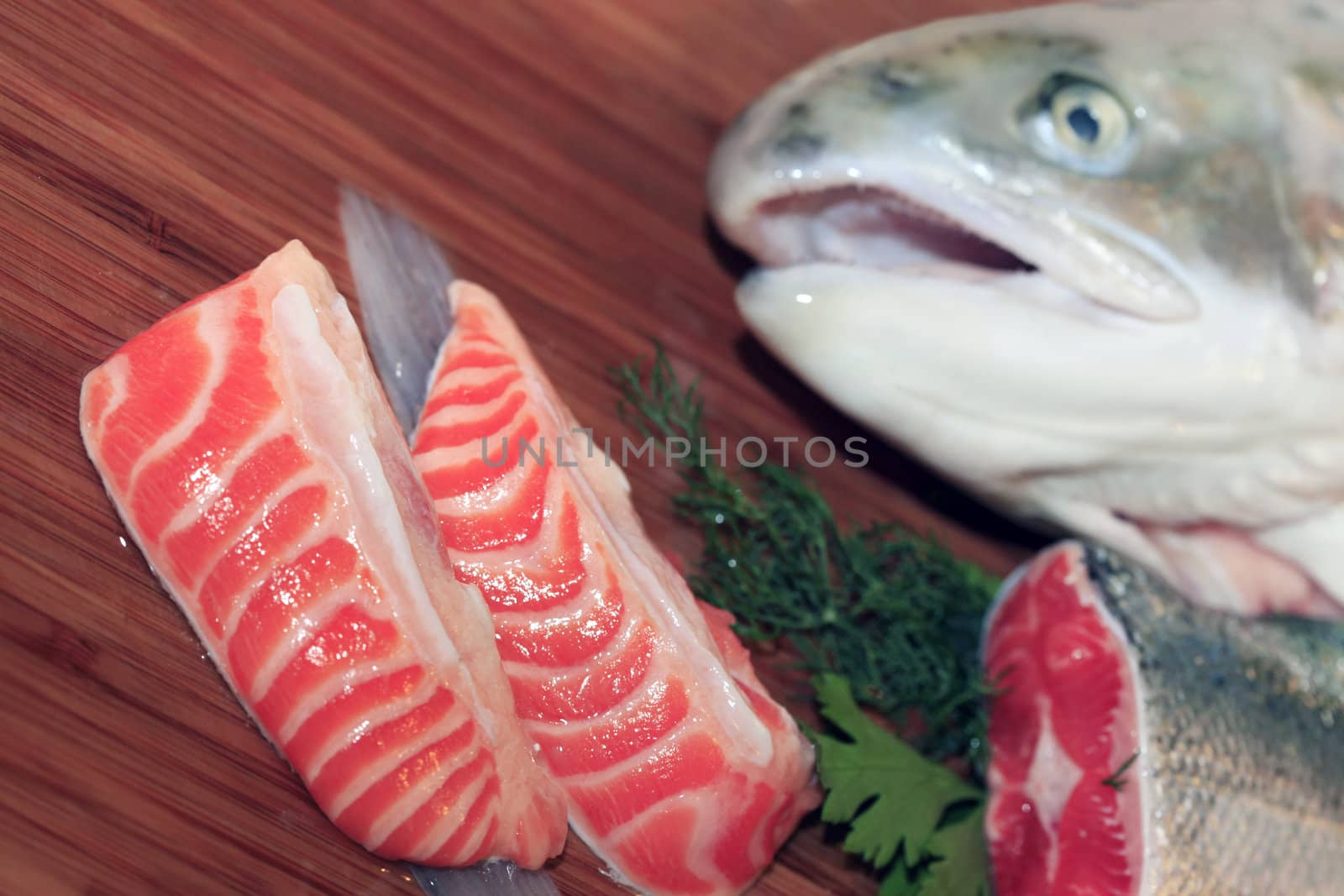 Fresh red salmon fish on wooden cooking desk