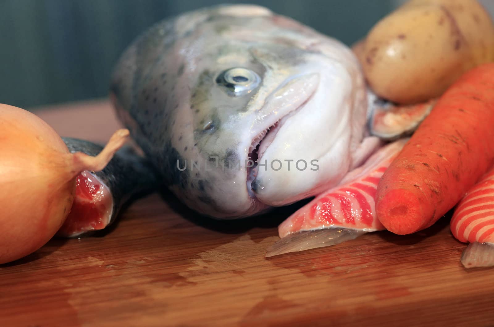 Fresh red salmon fish on wooden cooking desk