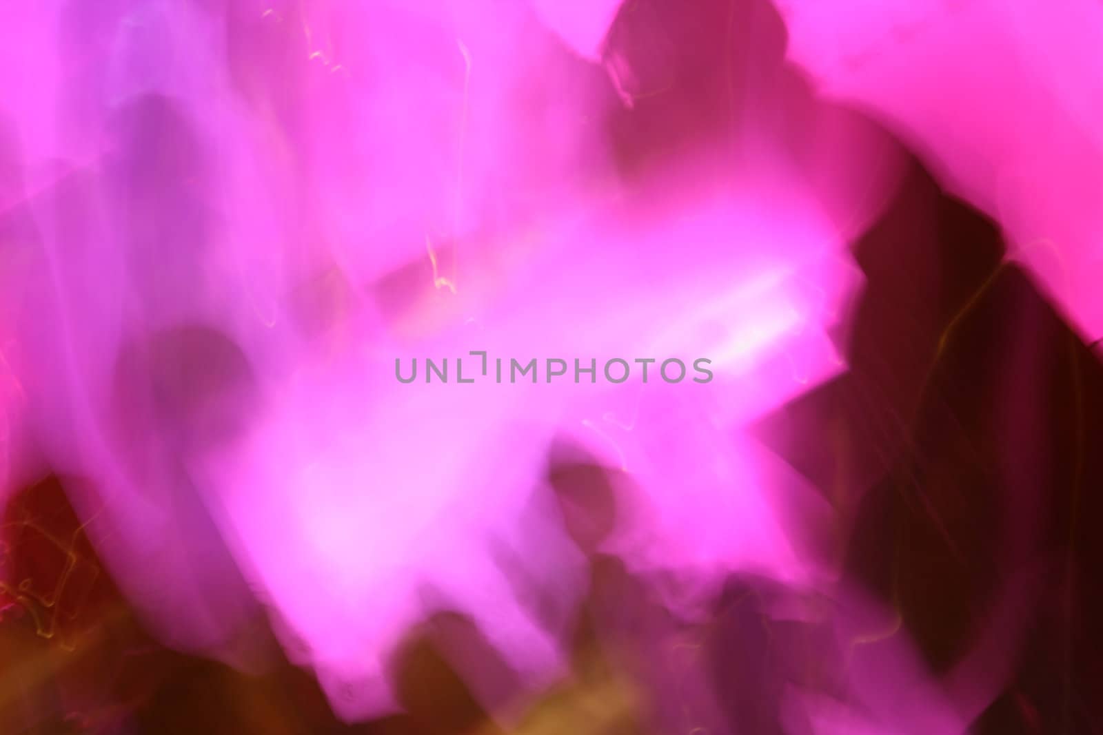 A very pink photo of a long exposure in a nightclub (hur hur).