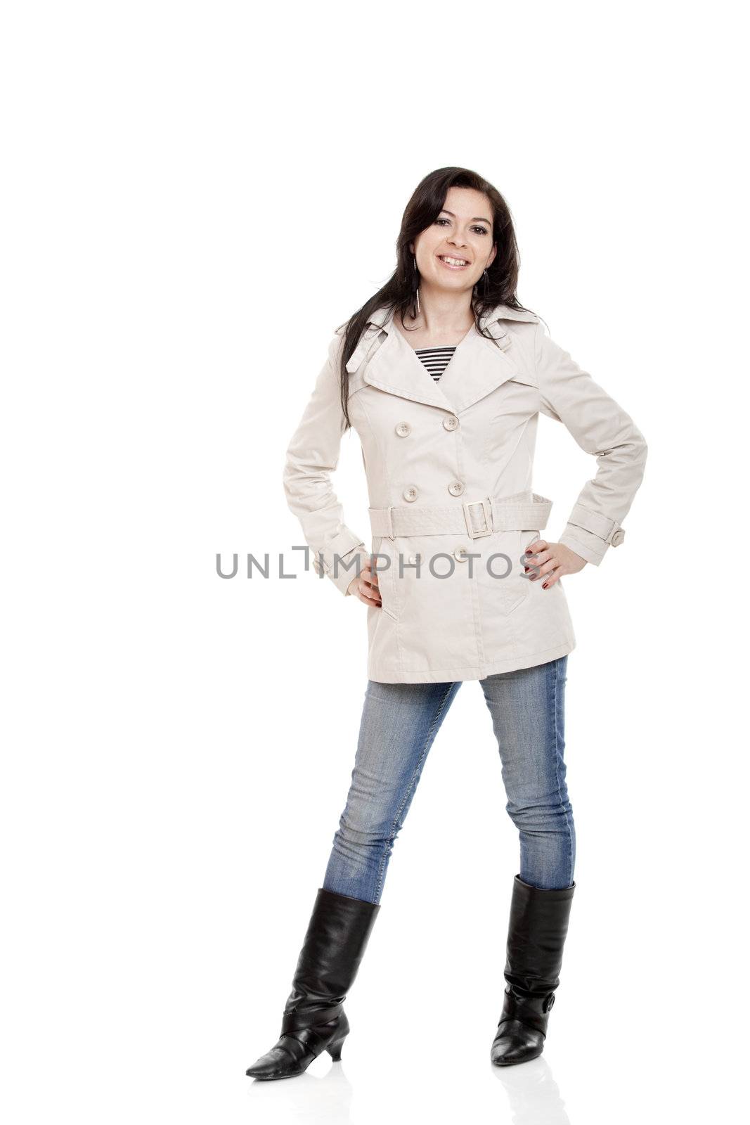 Modern young woman standing over a white background