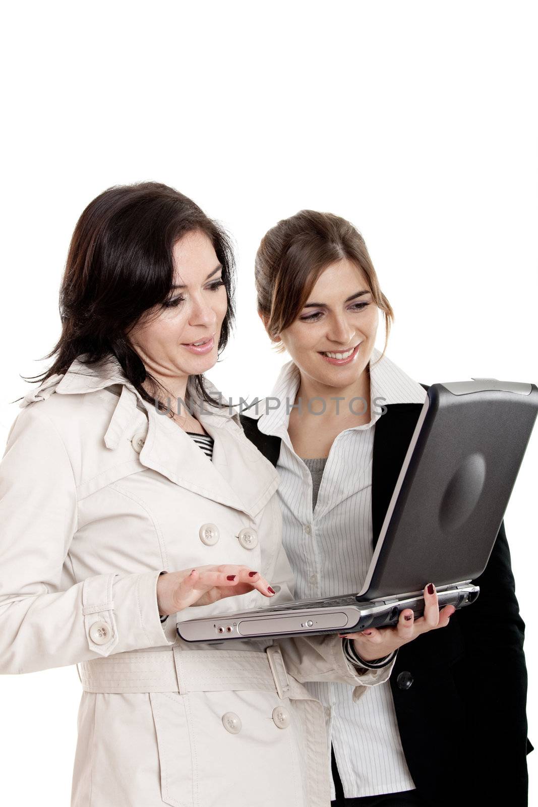 Two female young students watching something on a laptop