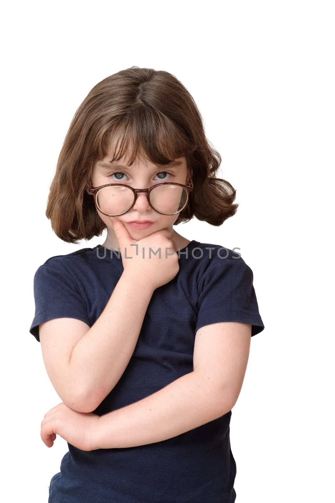 Thoughtful little girl in round spectacles rests her head on her hand isolated