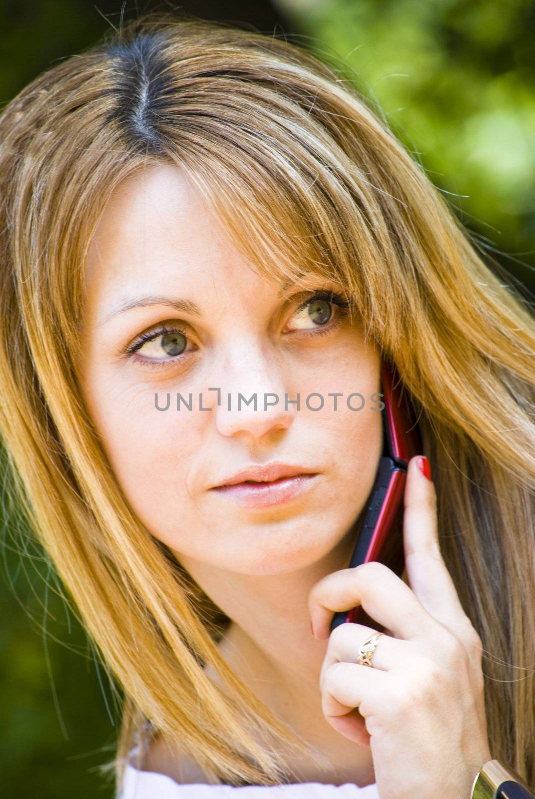 beautiful young woman talking on phone by Dessie_bg