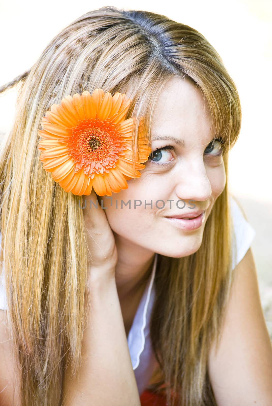 beautiful young blonde woman with flower