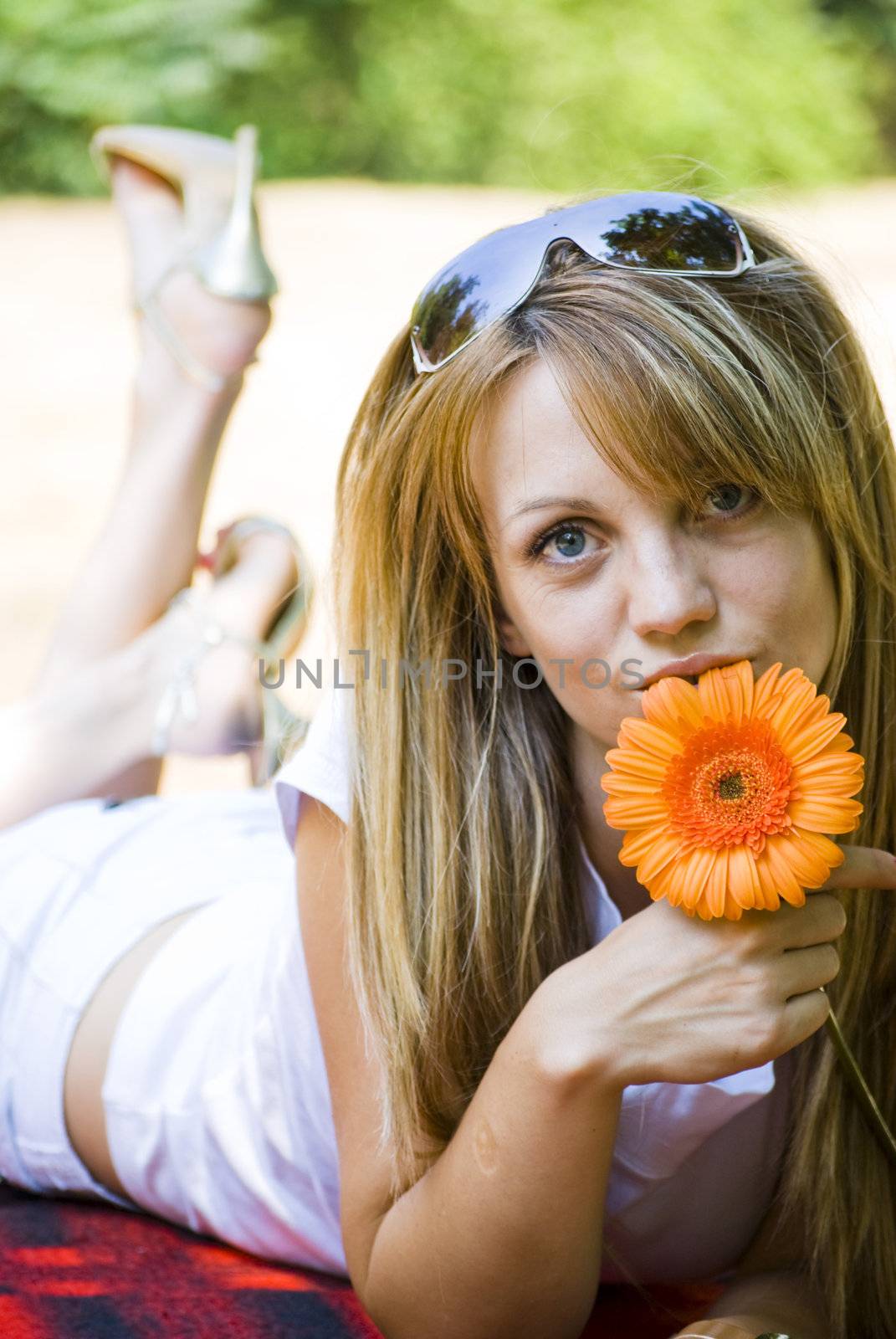 beautiful young blonde woman with flower