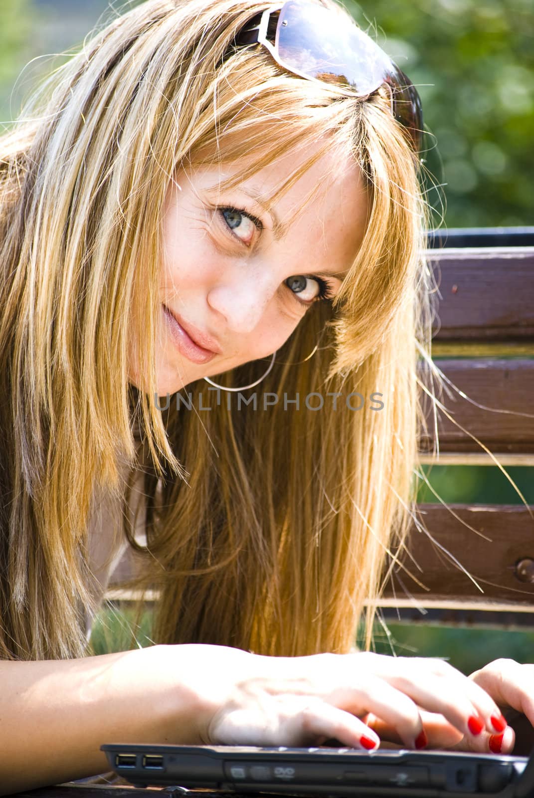 beautiful young woman working out with laptop or notebook