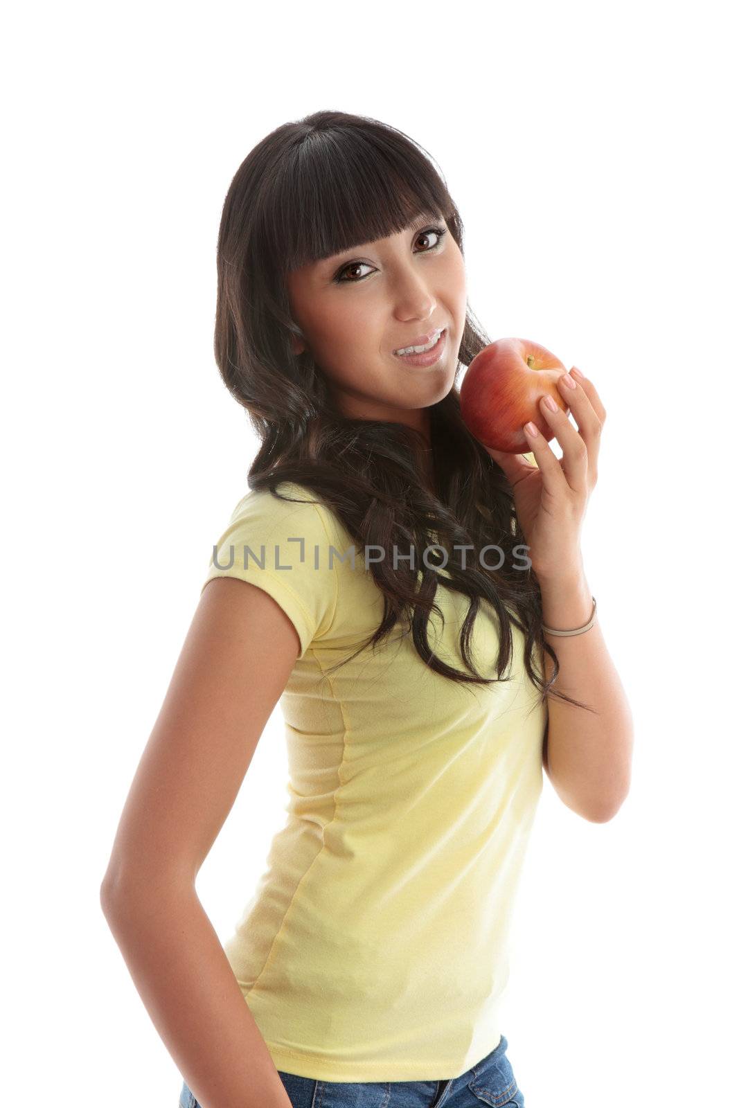 A young pretty woman eating a healthy juicy apple.  White background.