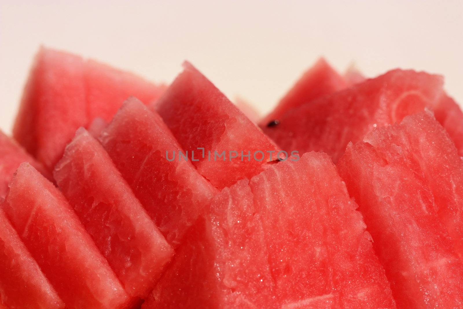 Juicy sliced ​​ripe watermelon neatly folded in plate