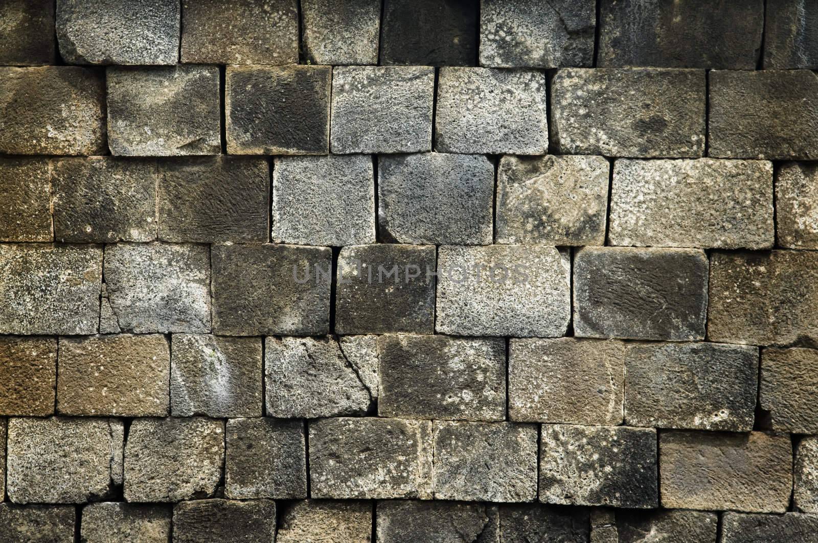Old stone wall, flat stacked background and texture. 